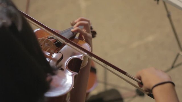 Woman playing the violin at a concert
