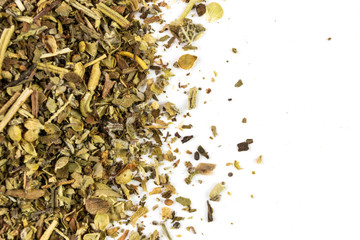 Spices are a mixture of spicy herbs for cooking meat and salads close-up on a light background. On the image there is a place for text, it is suitable as a background for culinary subjects. Macro.