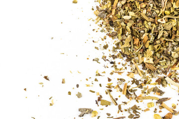 Spices are a mixture of spicy herbs for cooking meat and salads close-up on a light background. On the image there is a place for text, it is suitable as a background for culinary subjects. Macro.