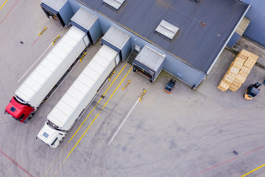 Aerial Shot Of Industrial Warehouse/ Storage Building/ Loading