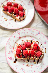 Homemade Toasts with Goat Cheese, Raspberries, Balsamic Cream and Pine Nuts