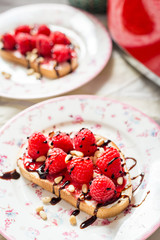 Homemade Toasts with Goat Cheese, Raspberries, Balsamic Cream and Pine Nuts