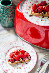 Homemade Toasts with Goat Cheese, Raspberries, Balsamic Cream and Pine Nuts