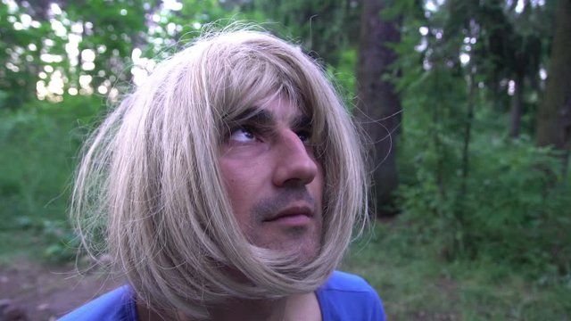 Transvestite junkies in white wig feeling euphoria after she got drugs dose