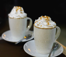 Two glasses of coffee with whipped cream
