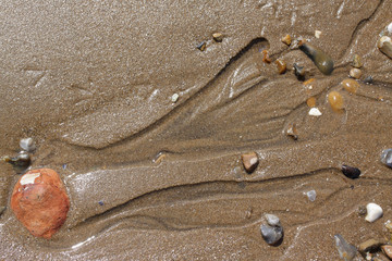 Patterns on the beach left by receding tide