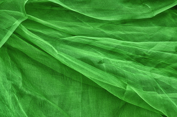 Close-up of plastic net. Artistic texture or background. Abstract plastic net texture. Green background.