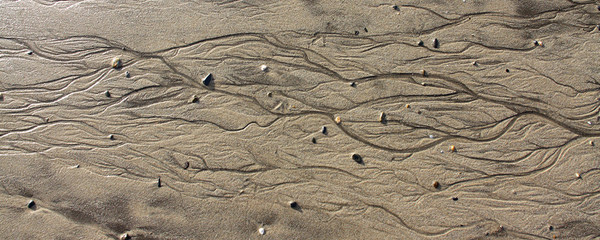 Patterns on the beach left by receding tide