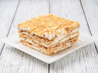 Slice of sweet classic layered cake Napoleon