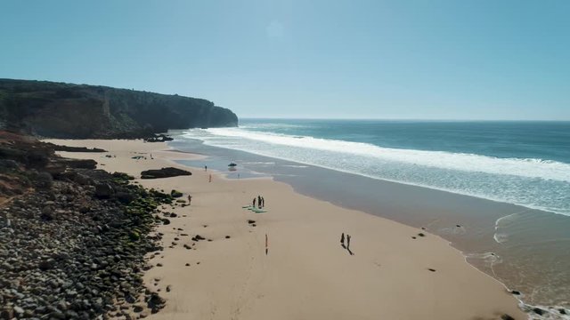 Aerial drone camera footage of beautiful sunny beach landscape near Atlantic ocean in Portugal