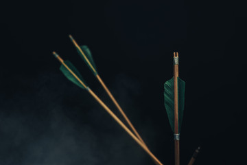 Four wood arrow. Beautiful smog background. Medieval weapons are handmade.