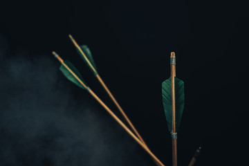 Four wood arrow. Beautiful smog background. Medieval weapons are handmade.
