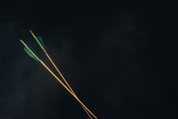 Two wood arrow. Beautiful smog background. Medieval weapons are handmade.