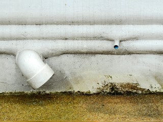 pipe on street wall with floor