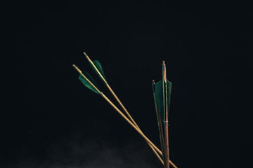 Four wood arrow. Beautiful smog background. Medieval weapons are handmade.