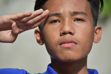 A Male Youngster Saluting