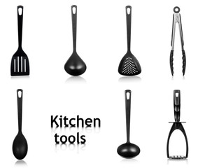 Black plastic kitchen utensils isolated on white