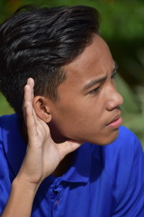 Fototapeta premium A Teen Boy Hearing