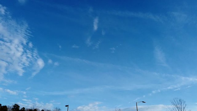 Daytime pan across time lapse of sky and clouds.
