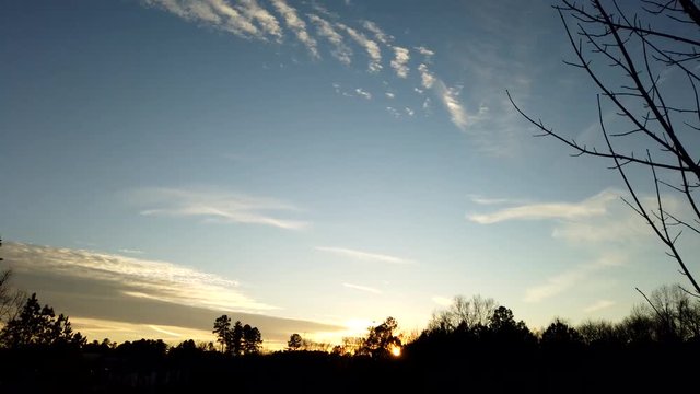 Sunset time lapse of clouds and chem trails