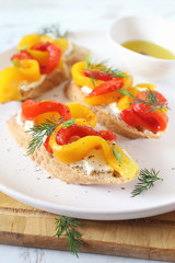 Appetizer. Slice of bread, cream cheese and grilled bell pepper with olive oil