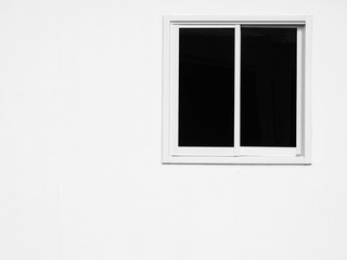 window on white building wall black and white style