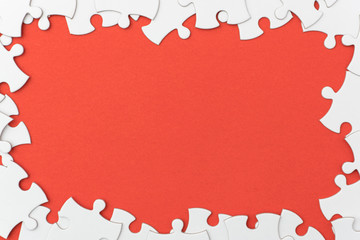 unfinished jigsaw puzzle texture on red background. connection concept. idea concept.association concept