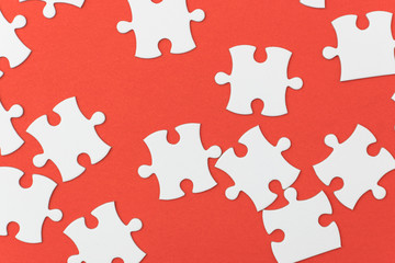 unfinished jigsaw puzzle texture on red background. connection concept. idea concept.association concept