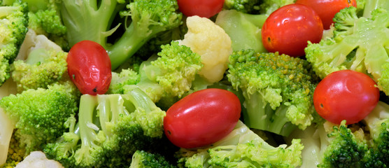 Closeup of broccoli and tomato salad platter