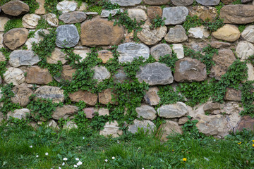Fototapeta na wymiar Medieval stone wall, castle of San Casciano, Italy.