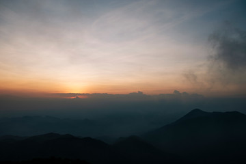 Light morning fog, sunrise and spectacular mountain ranges lined alternated beautifully. Khao Jed Yod, Trang in Thailand.