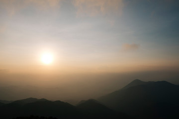 Light morning fog, sunrise and spectacular mountain ranges lined alternated beautifully. Khao Jed Yod, Trang in Thailand.