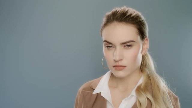 Suspicious woman face. Close up of business woman looking distrusting