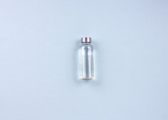 Flat lay singl bottle of water on blue background. Weight loss concept. Top view.