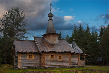 Fototapeta na wymiar Russia. Karelia. Ancient Orthodox Church on the shore of lake Ladoga, built of wood without a single nail