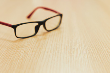 eyeglasses on wooden table office