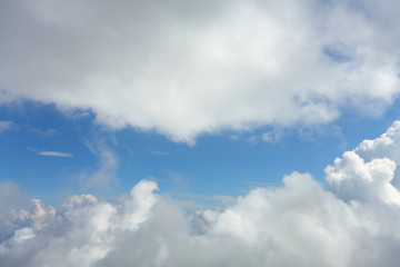 Fototapeta na wymiar fluffy white cloud moving above dream sky background