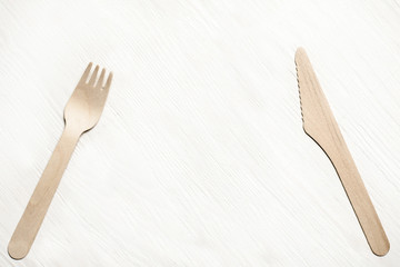 Disposable tableware from natural materials, wooden  fork, knife, eco-friendly. Place for text