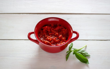 Chopped tomatoes on a white background. Top view.