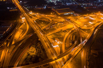 Fototapeta na wymiar Aerial view. Traffic of expressways, motorways and highways at night