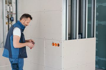 Handyman cutting something with snips