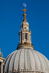 Fototapeta na wymiar The Moon Perched on St. Pauls Cathedral