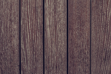 Dark brown wood texture background. Dark brown wooden fence. Dark wooden boards close-up. Pattern on dark wood backdrop.  Wood brown texture. Dark brown background. Old wall wooden vintage floor.