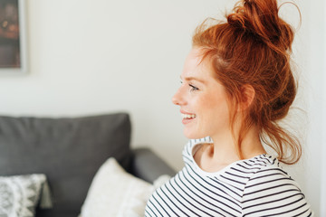 Side portrait of woman with red hair, copy space