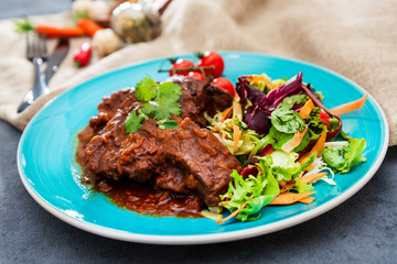 juicy grilled pork leg with fresh salad