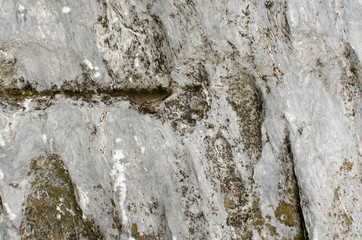 Rock texture and surface background. Cracked and weathered natural stone background.