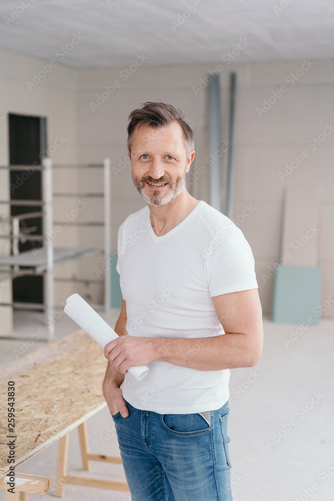 Sticker homeowner or handyman holding plans of a new build