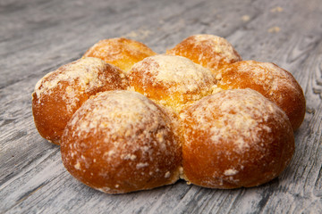 fresh homemade buns on wooden background