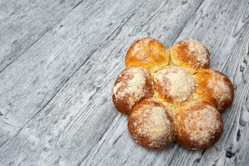 fresh homemade buns on wooden background