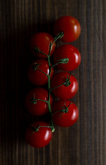 Tomatoes on wooden background. Top view. Vegetarian food
